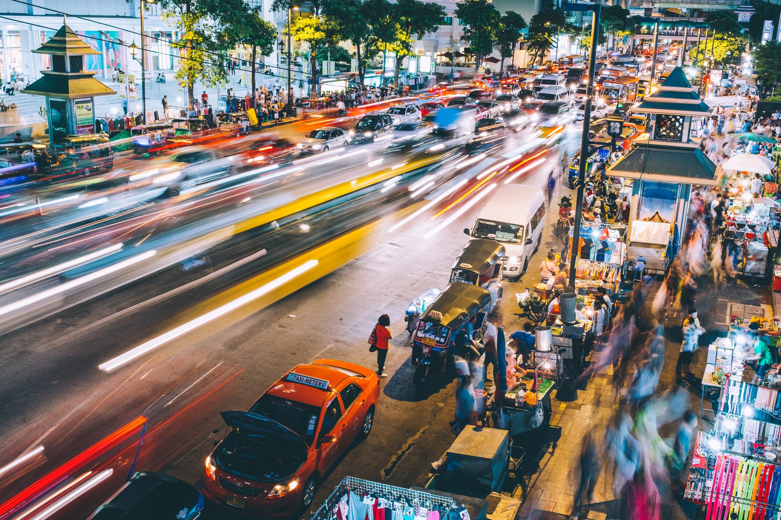 a busy Bangkok street at night